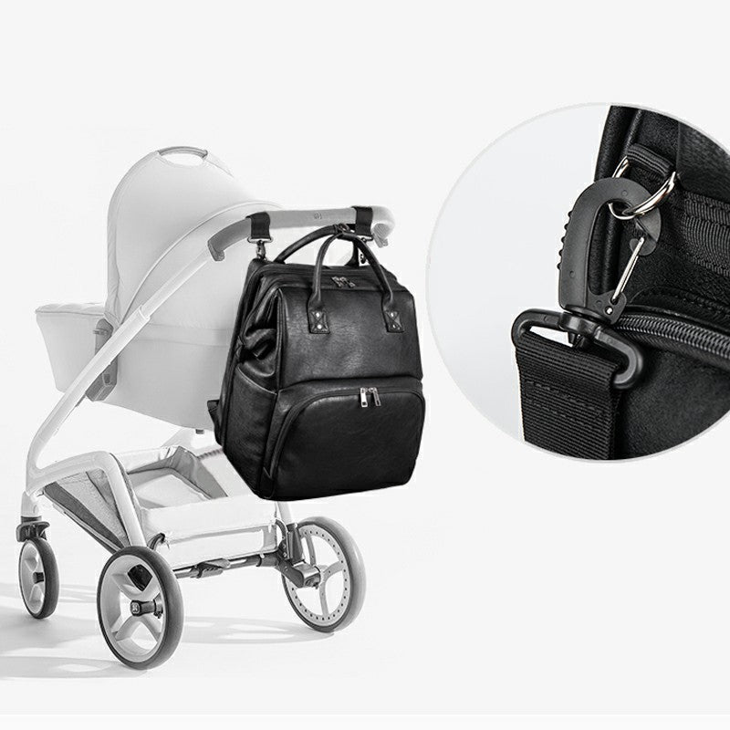 Mochila dobrável multifuncional para mãe e bebê, ideal para berço.