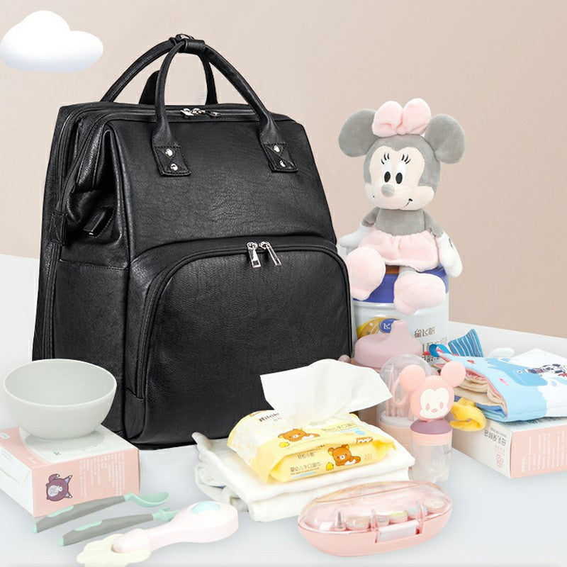 Mochila dobrável multifuncional para mãe e bebê, ideal para berço.