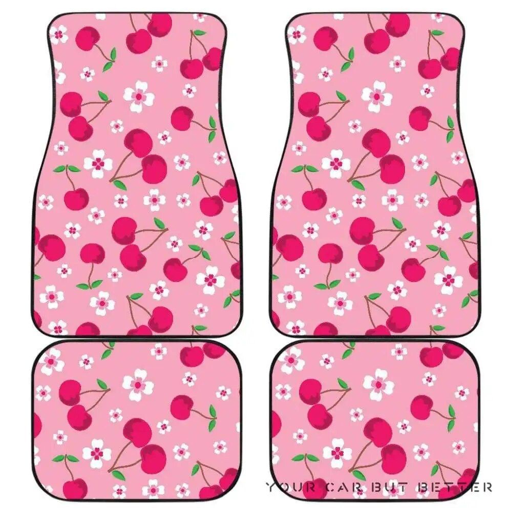 Tapetes de carro com estampa de flor de cerejeira e fundo rosa.