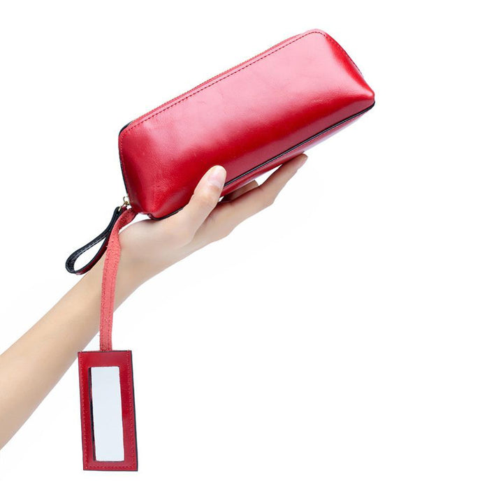 Portable female hand holding cosmetic bag - MRSLM